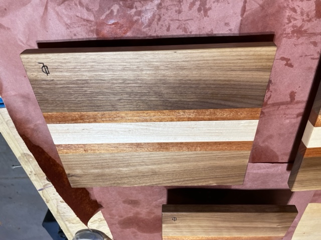 Cutting board made of real wood on a work table.