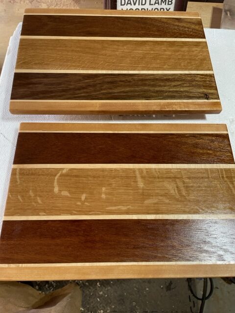 Two cutting boards on a work table.