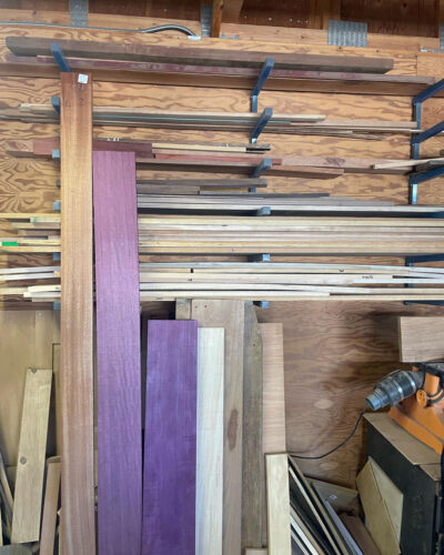 Different colored wood on shelves.