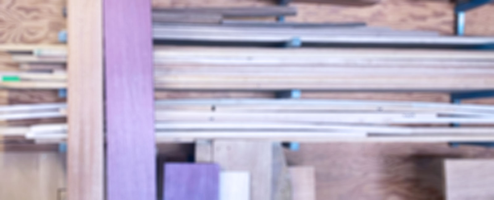 Stacks of wood on shelves.