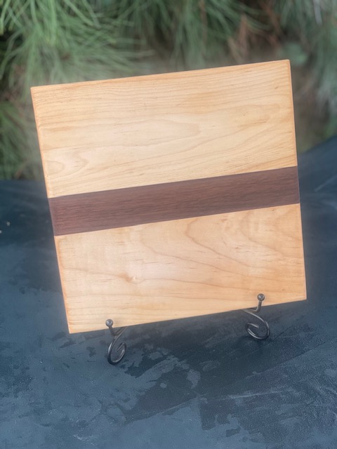 Black walnut and maple light colored cutting board.