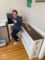 Custom wood corner coffee table. Pictured Christine Zito, owner of Pure Media Marketing standing in front of coffee table at her office/studio.