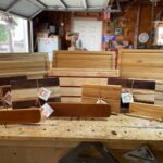 Display of custom cutting boards on a table.