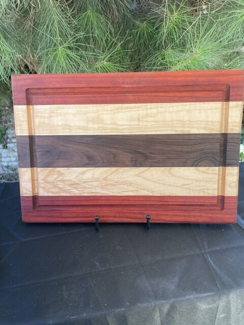 black walnut, padauk. maple cuttimg board juice groove